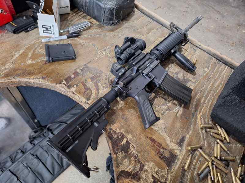 Bushmaster XM-15 E2S W/Aimpoint PRO